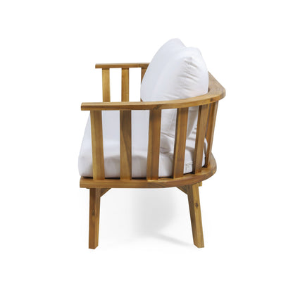 Acacia wood outdoor chair with white cushions and curved armrests on Tampa Home & Garden Store