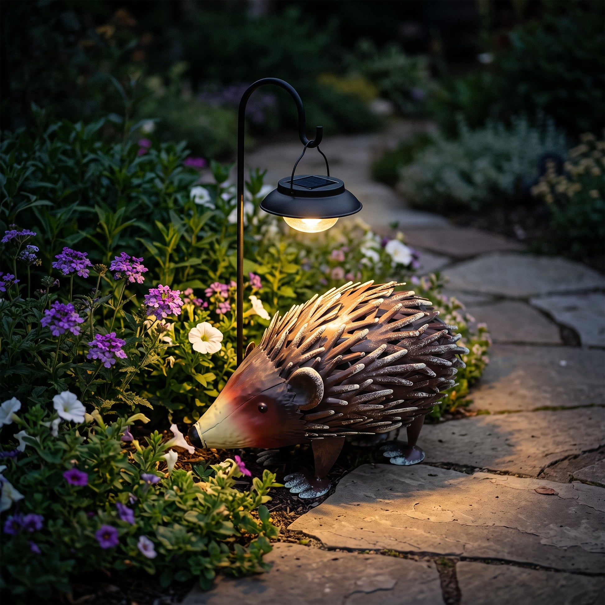 Handmade wrought iron hedgehog garden statue with spiky brown body beside a solar lantern on Tampa Home & Garden Store