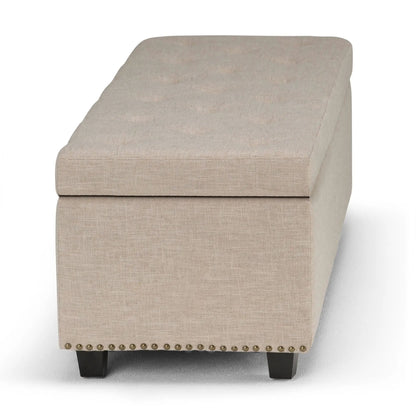 Hamilton Upholstered Storage Ottoman beige linen fabric with nailhead trim and dark legs on Tampa Home & Garden Store