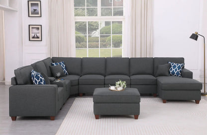 Eric - 9 Piece Upholstered Sectional With Ottoman in dark gray fabric with blue patterned pillows on Tampa Home & Garden Store