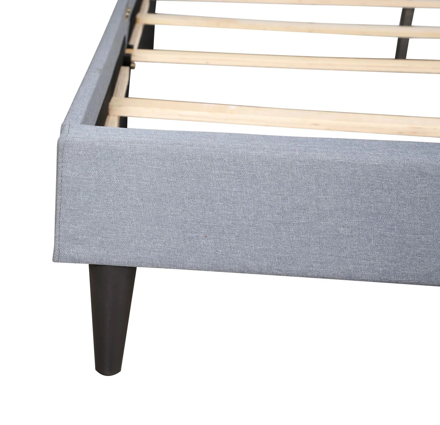 Button tufted bed upholstered in gray fabric with exposed wooden slats and black legs on Tampa Home & Garden Store