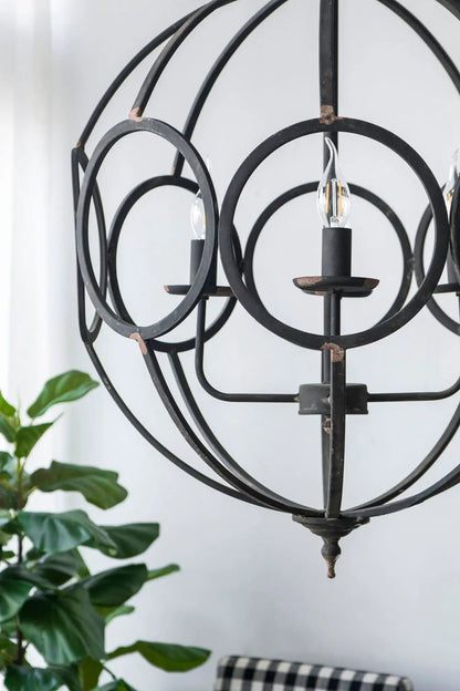 4-light black metal chandelier with circular rings and candle-style bulbs on Tampa Home & Garden Store