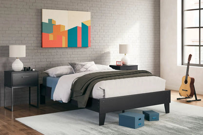 Socalle Platform Bed by Unique Piece Furniture in black wood with white quilted bedding on Tampa Home & Garden Store
