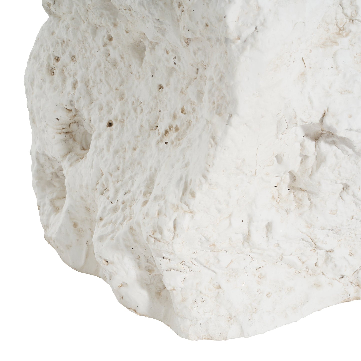 White textured rock surface with rough, pitted details and subtle beige specks on Tampa Home & Garden Store