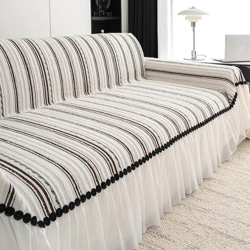 Sofa cover striped cream and brown with black pom-pom trim and pleated skirt on Tampa Home & Garden Store