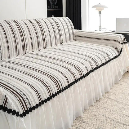 Sofa cover striped cream and brown with black pom-pom trim and pleated skirt on Tampa Home & Garden Store