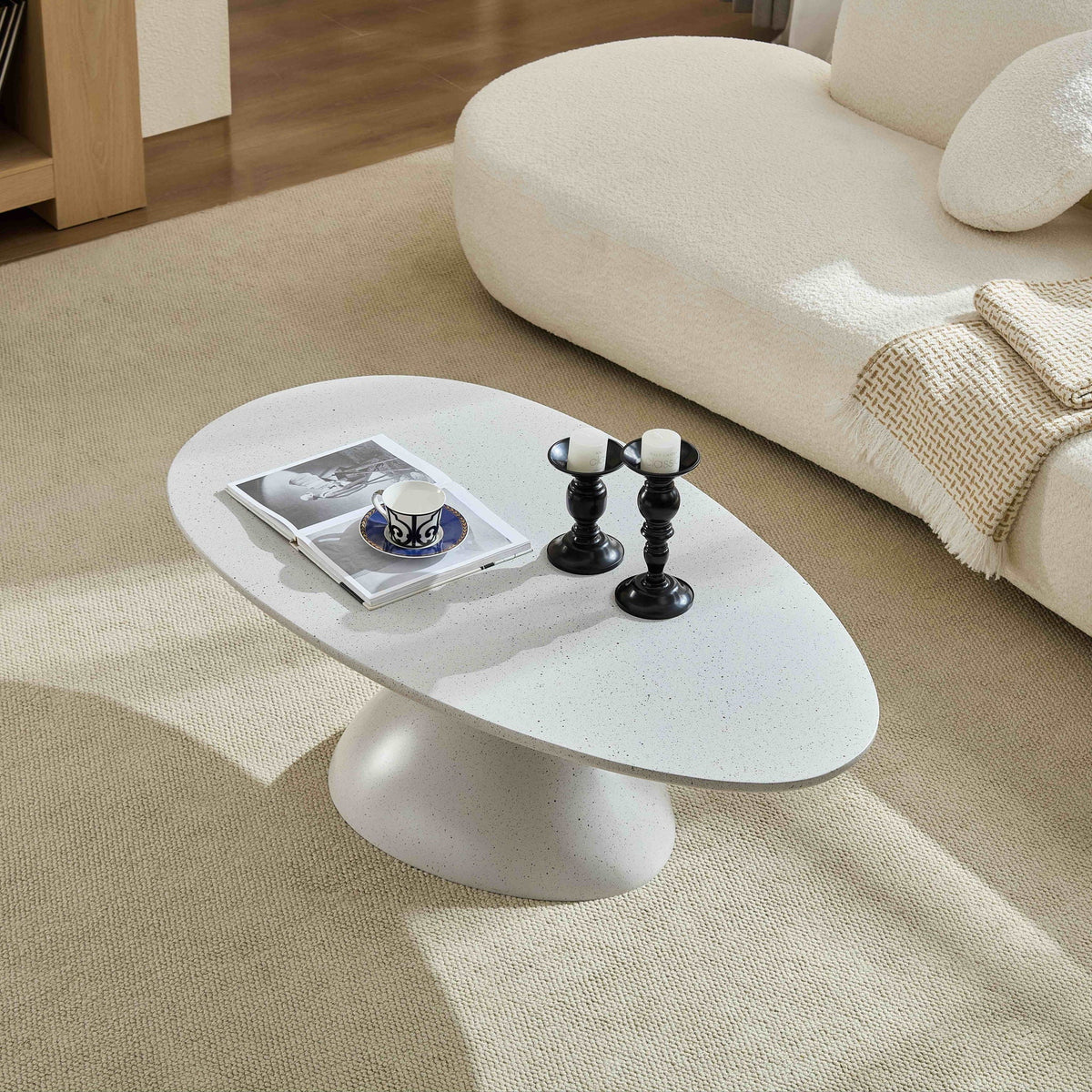 Lucky Stone Shaped End Tables with sculptural black bases and white speckled tops in a room on Tampa Home & Garden Store