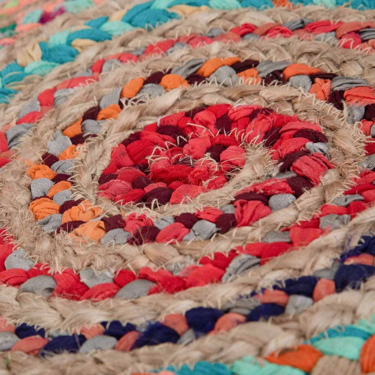 Margo handcrafted round pouf close-up of multicolor woven yarn texture beige red blue on Tampa Home & Garden Store