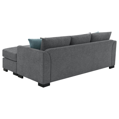 Pacheco sleeper sectional chaise sofa in dark gray textured fabric with teal accent pillow on Tampa Home & Garden Store