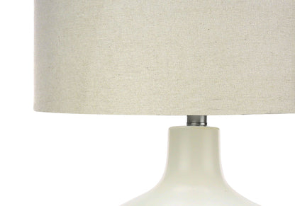 Table lamp with cream fabric shade and white ceramic base with chrome neck on Tampa Home & Garden Store