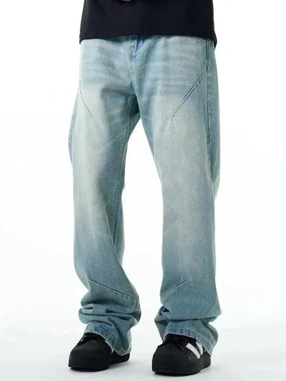 Washed distressed jeans, light blue denim, straight loose fit with faded panels on Tampa Home & Garden Store