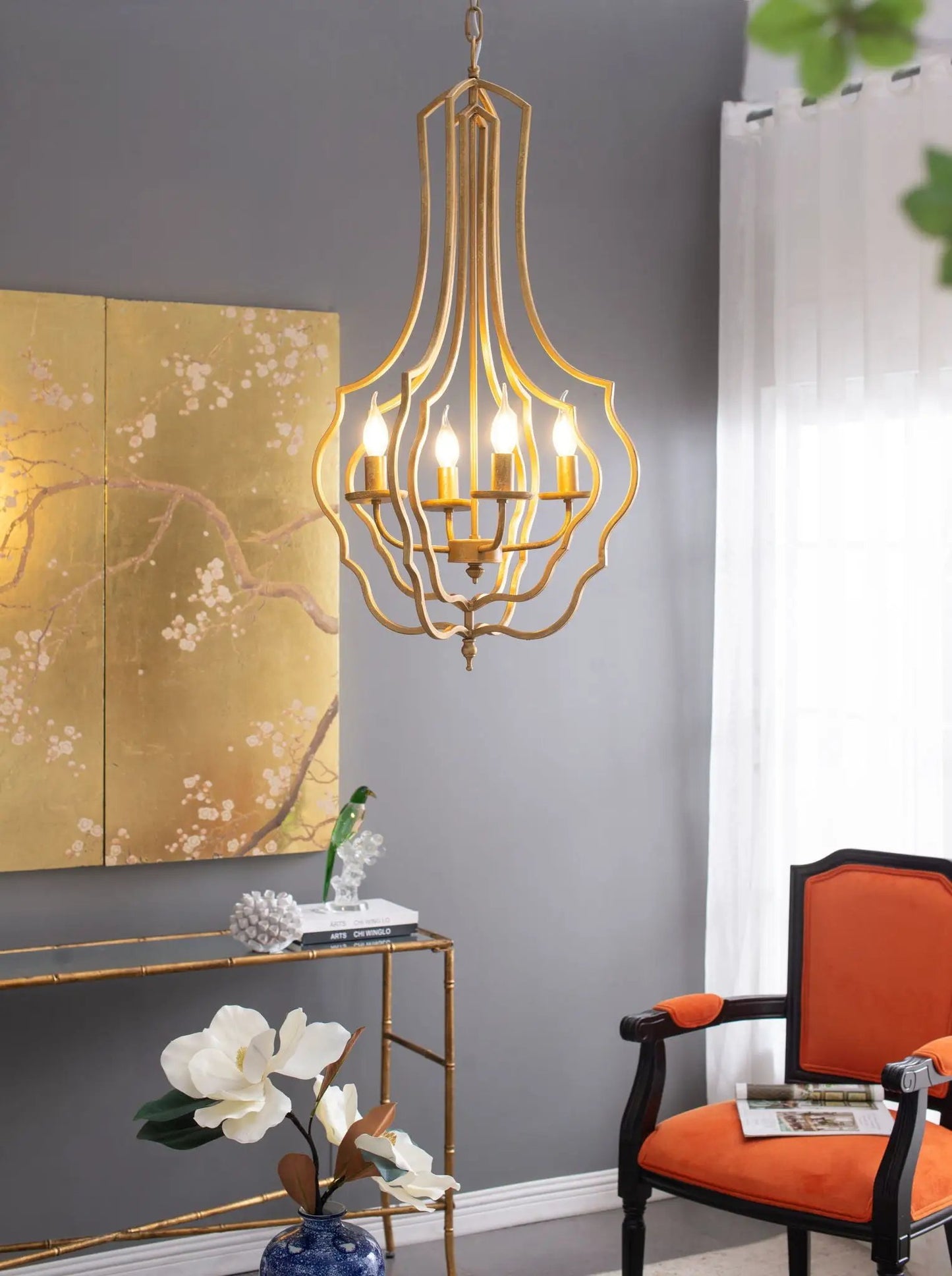 4-light gold chandelier with an open cage frame and adjustable chain by Unique Piece Furniture on Tampa Home & Garden Store