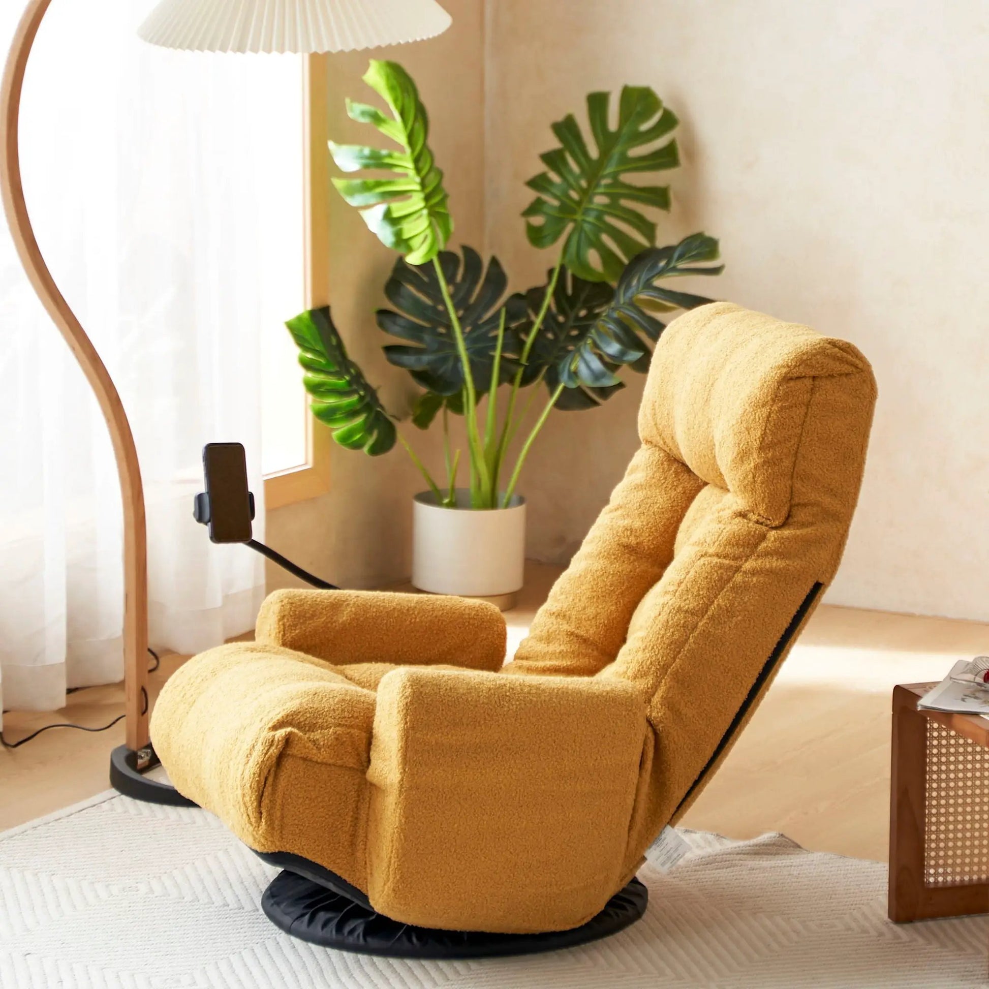 Adjustable swivel lounge chair in tan fabric with 360-degree rotating seat and headrest on Tampa Home & Garden Store