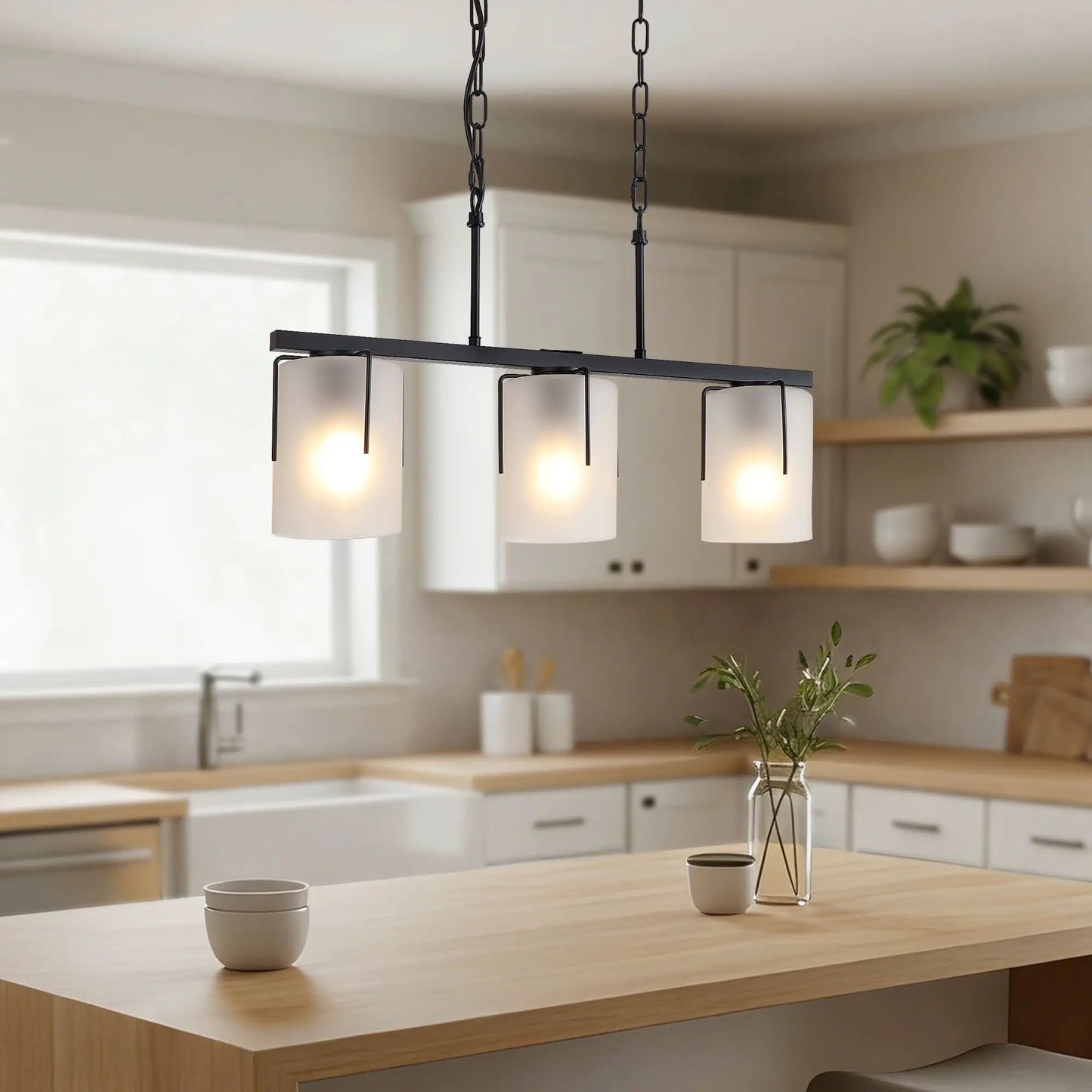 Adjustable cylindrical pendant light with four frosted glass shades on a black metal frame on Tampa Home & Garden Store