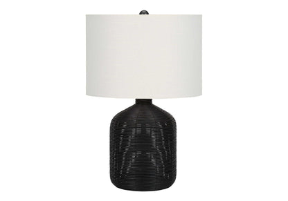 Table lamp by HouseOfZazla with black rattan base and white textured drum shade on Tampa Home & Garden Store