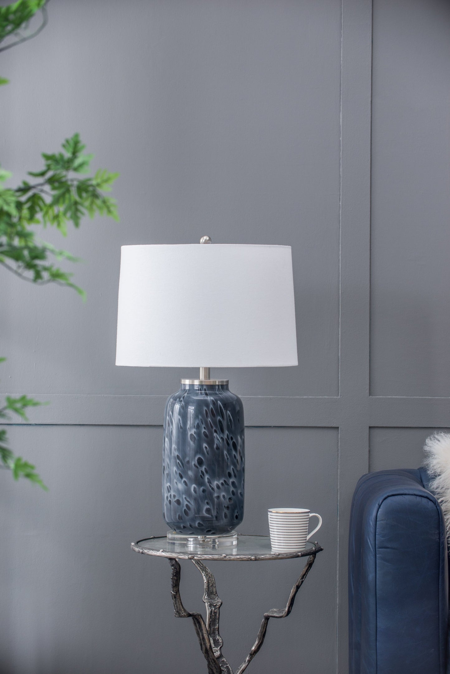 Ellis Glass Table Lamp blue textured ceramic base with white drum shade on a small round table on Tampa Home & Garden Store