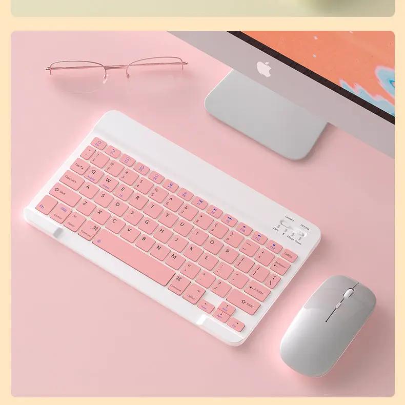 Wireless Mouse by FLIPSTYLEZLLC, silver gray beside a pink keyboard on a pink desk on Tampa Home & Garden Store