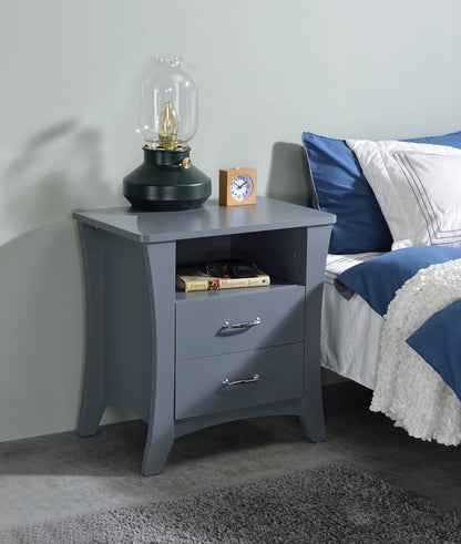 Colt accent table in blue-gray finish with metal hardware, lamp and small clock on top on Tampa Home & Garden Store