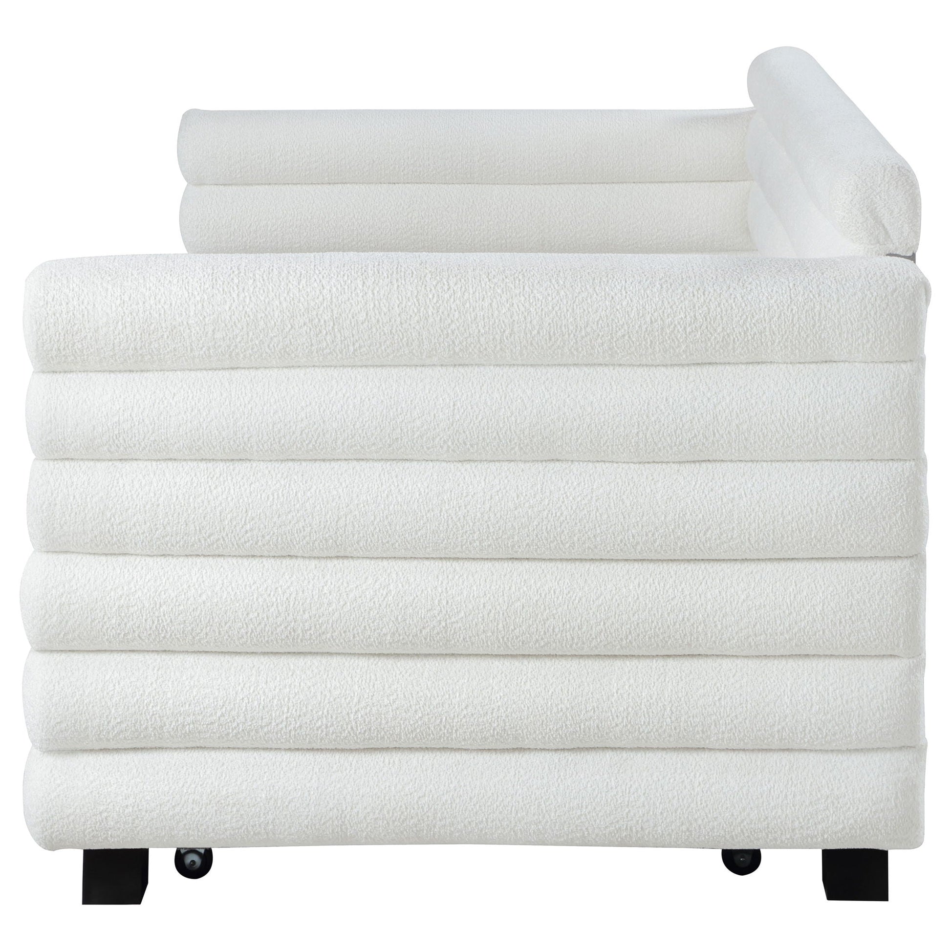 White bath towel set stacked neatly with one rolled towel on top; black metal legs visible on Tampa Home & Garden Store