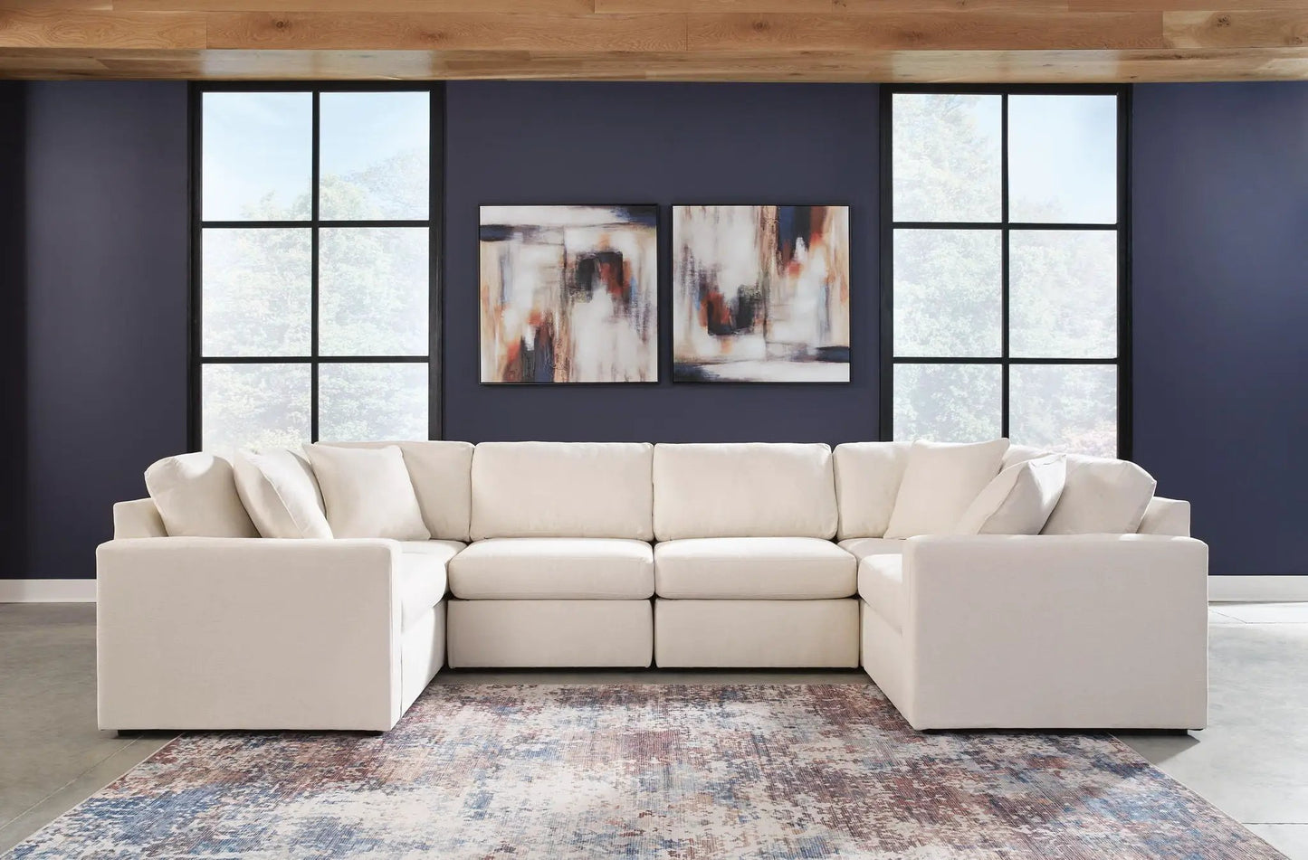 Modmax Sectional Oyster beige fabric stationary sofa with plush cushions against a navy wall on Tampa Home & Garden Store