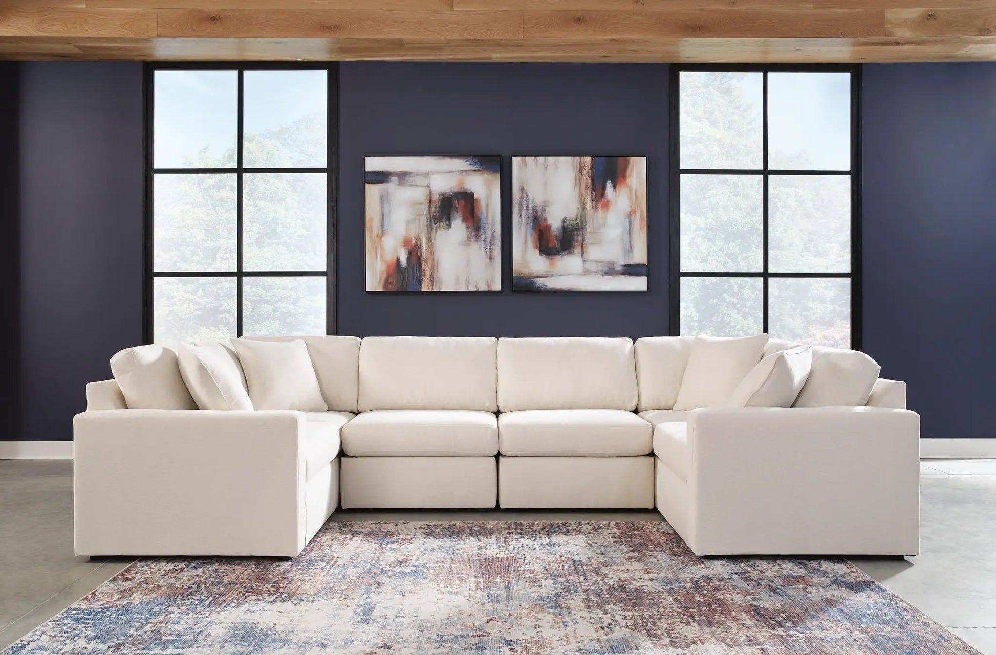Modmax Sectional Oyster beige fabric stationary sofa with plush cushions against a navy wall on Tampa Home & Garden Store
