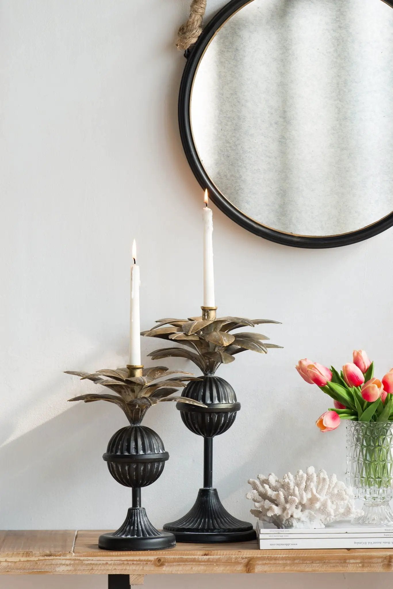 Handsome Cleveland round wall mirror with black metal frame and natural rope hanger on Tampa Home & Garden Store