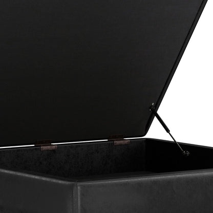 Square lift-top storage ottoman coffee table in black faux leather, interior storage visible on Tampa Home & Garden Store