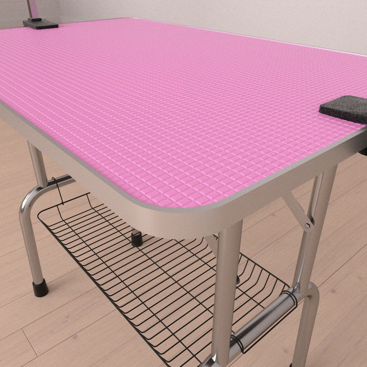 Folding dog grooming table with pink rubber mat on board and stainless steel frame on Tampa Home & Garden Store