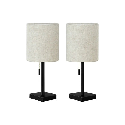Pair of table lamps with beige fabric drum shades, black square bases, and pull chains on Tampa Home & Garden Store
