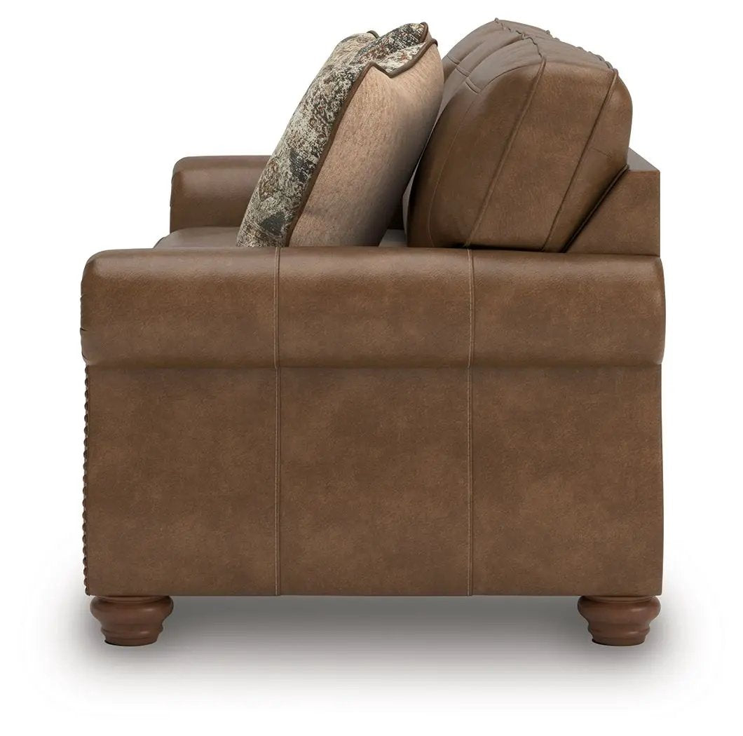 Chasemore sofa brown leather upholstery by Unique Piece Furniture with patterned cushion on Tampa Home & Garden Store