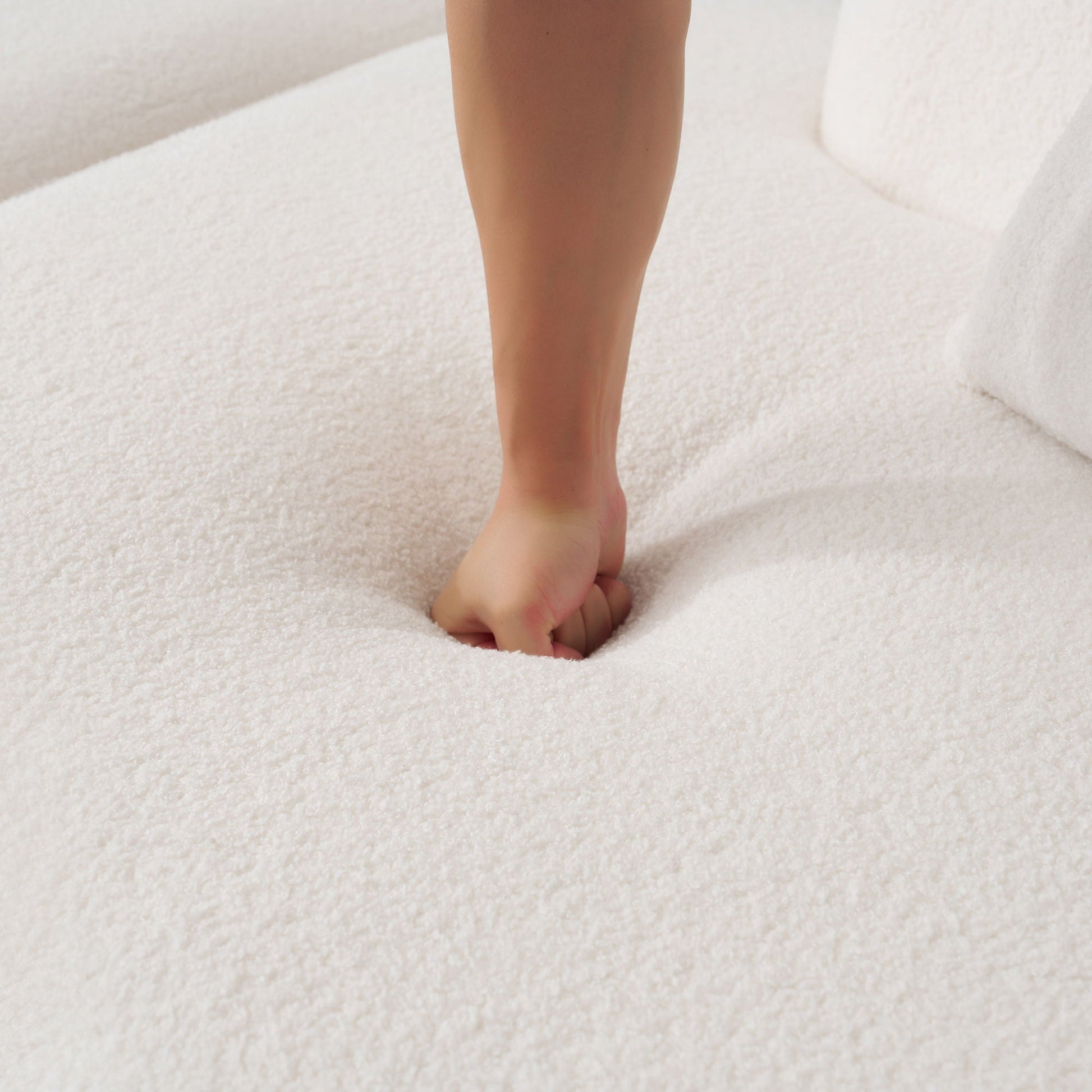 Foot and lower leg on soft white carpet in a bright room on Tampa Home & Garden Store