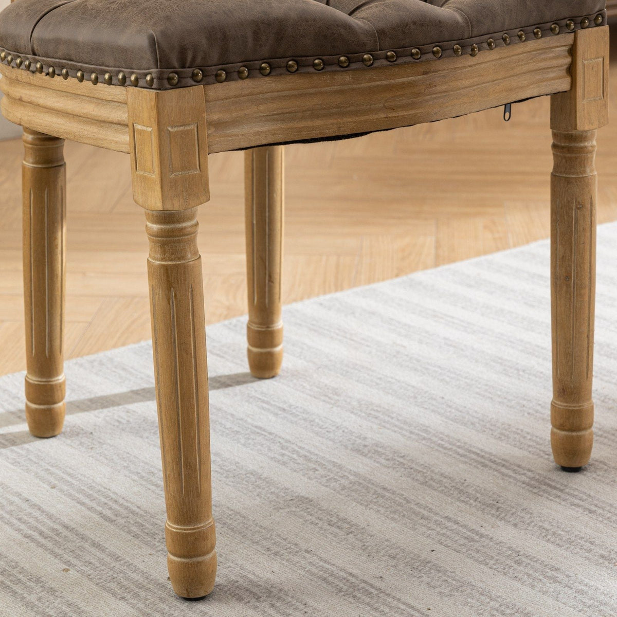 French style solid wood dining chair with nailhead trim, brown faux leather seat, light oak legs on Tampa Home & Garden Store