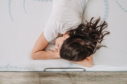 8-inch memory foam mattress white cover with blue dot pattern; person resting on bed on Tampa Home & Garden Store
