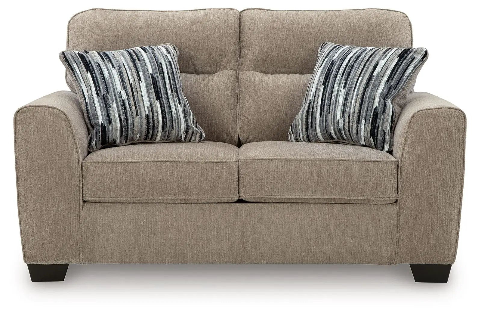 Olten living room sofa beige fabric upholstery with two striped throw pillows on Tampa Home & Garden Store