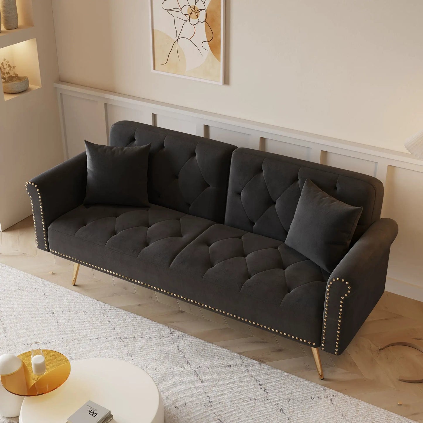 Luxurious futon sofa bed with nail head trim and matching pillows in dark gray velvet on Tampa Home & Garden Store