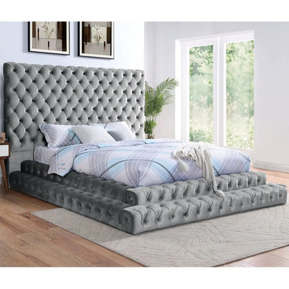 Tufted oversized platform bed with gray fully upholstered frame and tall headboard on Tampa Home & Garden Store