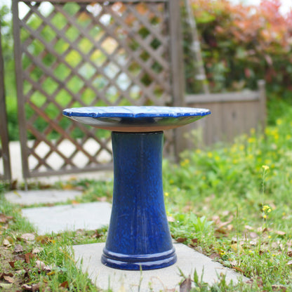 Handmade sapphire glazed ceramic bird bath atop a blue pedestal on Tampa Home & Garden Store