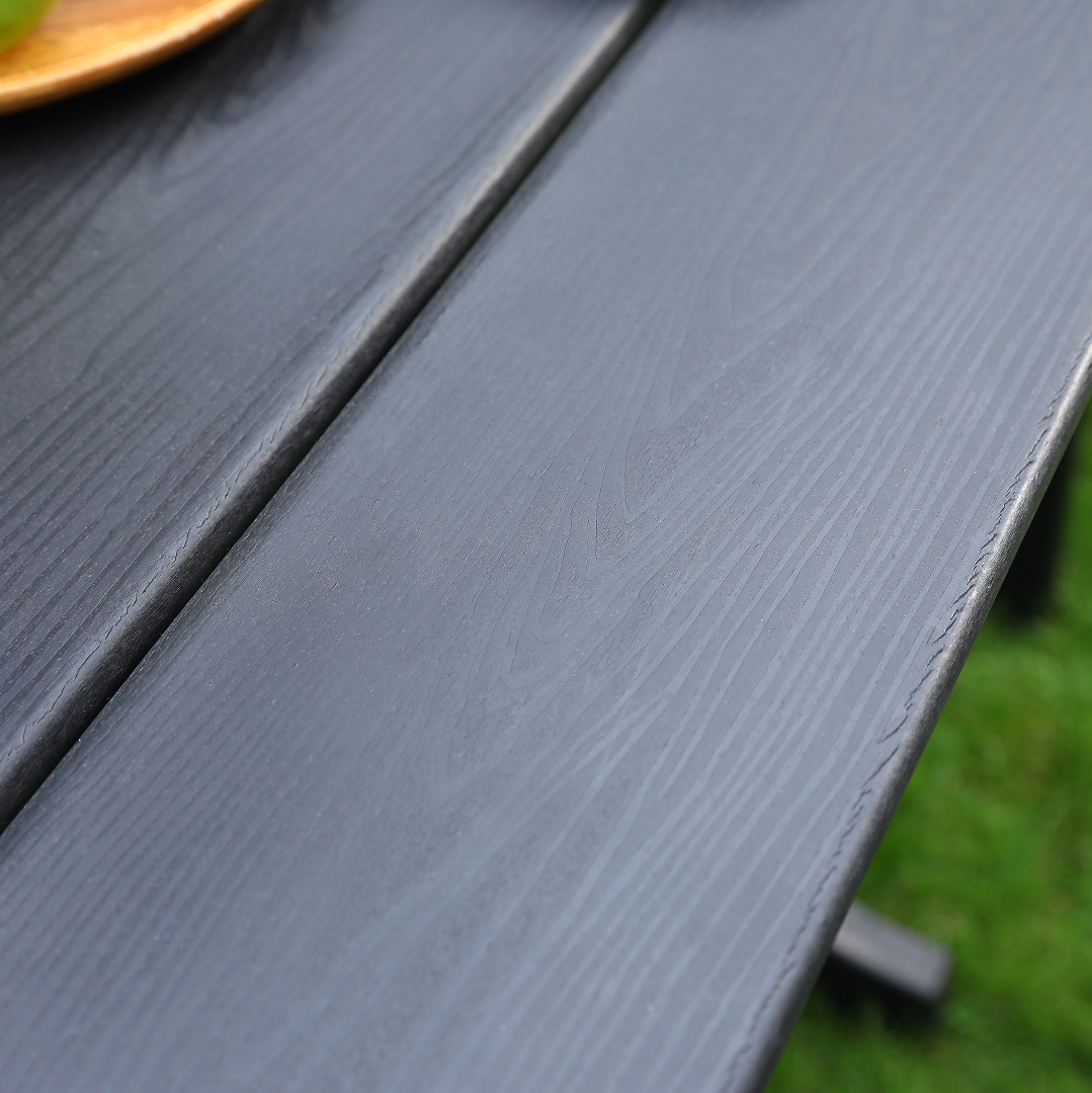 HDPE outdoor terrace dining chair set of 2 in black, close-up of textured slats on deck on Tampa Home & Garden Store