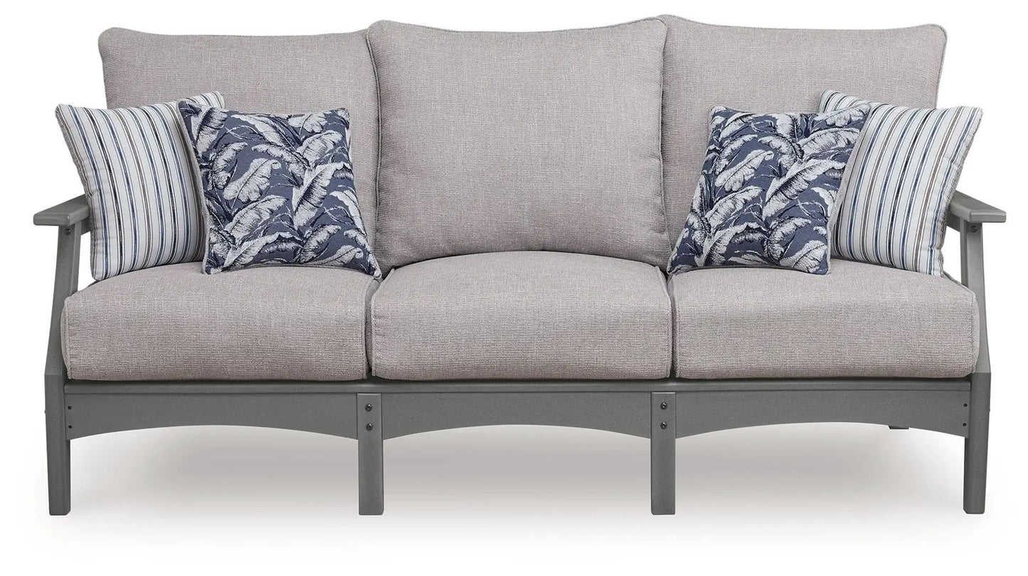 Cove Beach sofa with cushion gray fabric on sturdy gray frame with blue leaf and striped pillows on Tampa Home & Garden Store