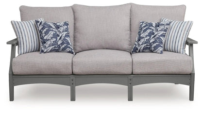 Cove Beach sofa with cushion gray fabric on sturdy gray frame with blue leaf and striped pillows on Tampa Home & Garden Store