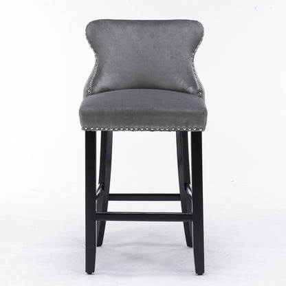 Upholstered wing-back barstool in gray velvet with button tufting and nailhead trim, black legs on Tampa Home & Garden Store