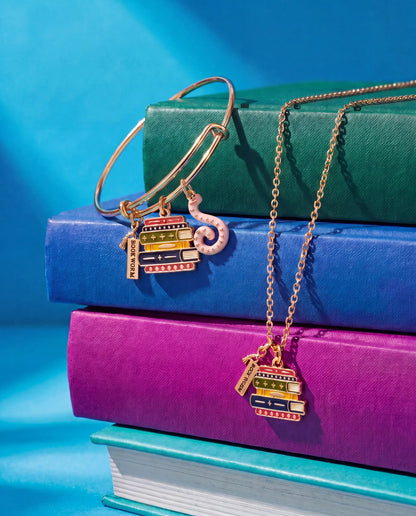 Book Club Multicharm Bangle by ALEX AND ANI in rose gold with book charms on colorful books on Tampa Home & Garden Store