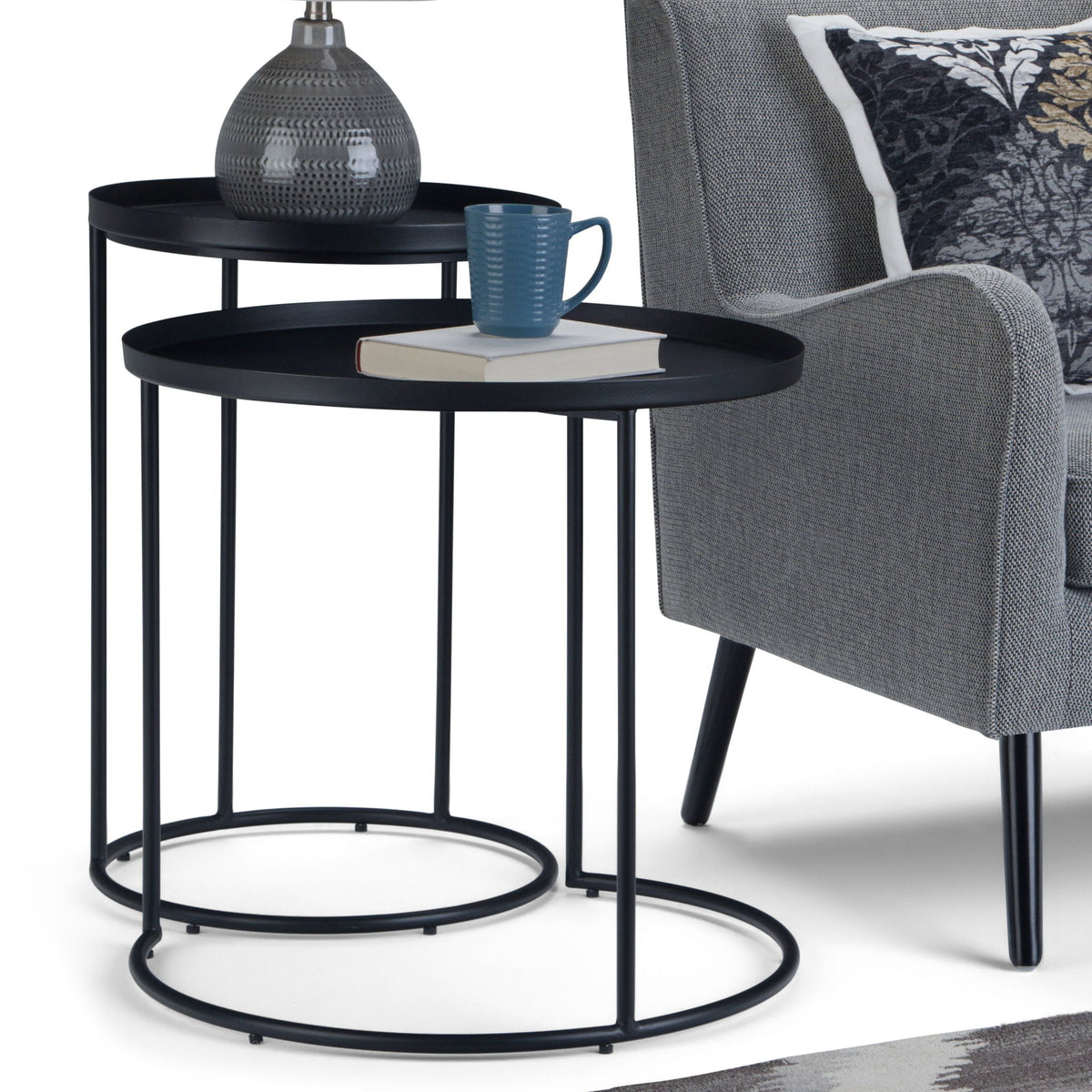 Monet Black Metal Nesting Tables by HouseOfZazla; two round black tables with blue mug on Tampa Home & Garden Store