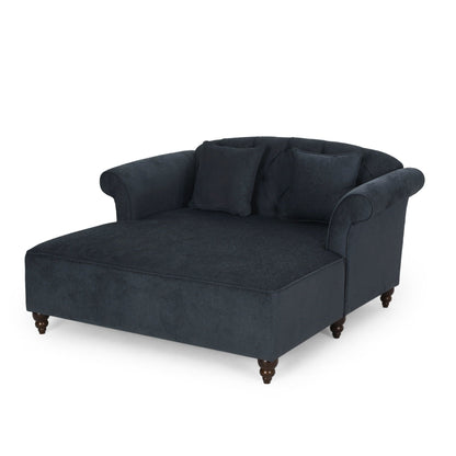 Elegant upholstered chaise in dark navy with gray pillows and turned wooden feet on Tampa Home & Garden Store