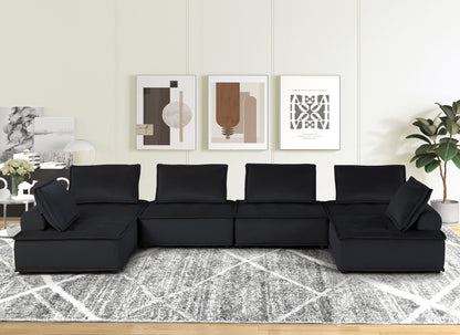Anna - Stylish Sectional Sofa Ottoman in black upholstery, modern living room with abstract art on Tampa Home & Garden Store