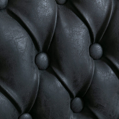 Dining chair close-up in black leather with button tufting on Tampa Home & Garden Store