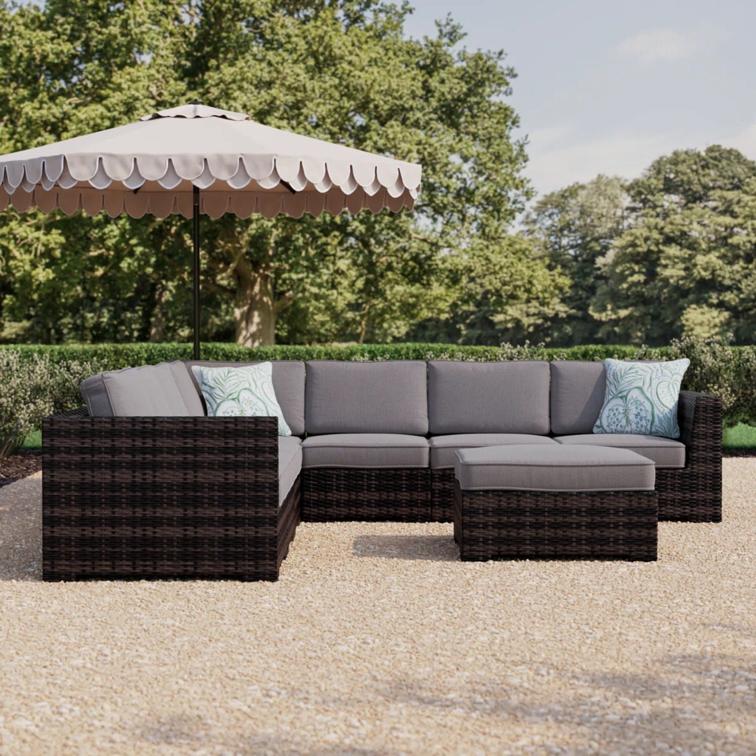 2pc outdoor wicker patio seating set with gray foam cushions and blue patterned throw pillows on Tampa Home & Garden Store