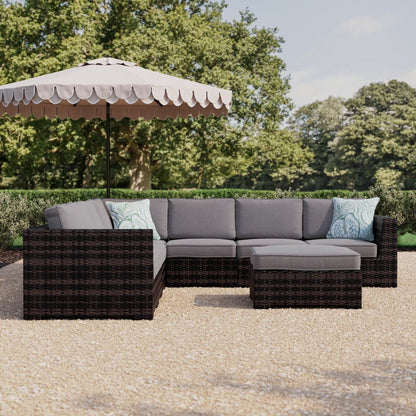 2pc outdoor wicker patio seating set with gray foam cushions and blue patterned throw pillows on Tampa Home & Garden Store