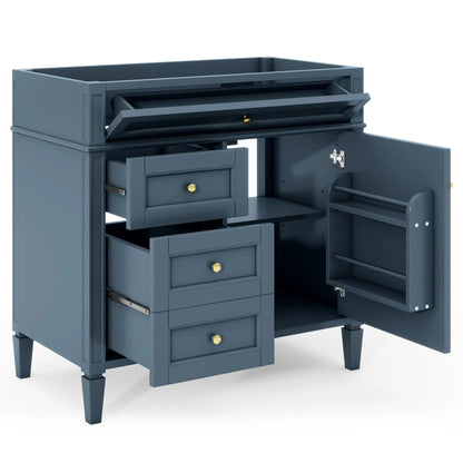 Blue-gray bathroom vanity base with two drawers and a tip-out drawer, brass knobs on Tampa Home & Garden Store