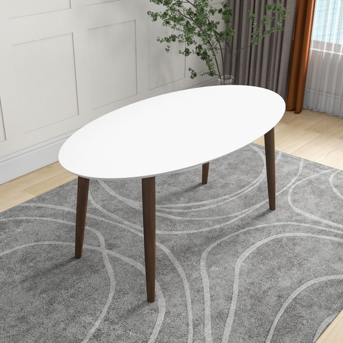 Mid-Century Modern oval dining table in white with solid wood legs in a bright living space on Tampa Home & Garden Store